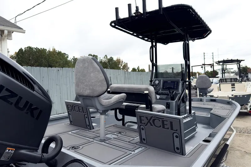 Slide: The Image of 2026 Excel Bay Pro Elite 230 boat with Suzuki engine, featuring advanced navigation controls. - 20