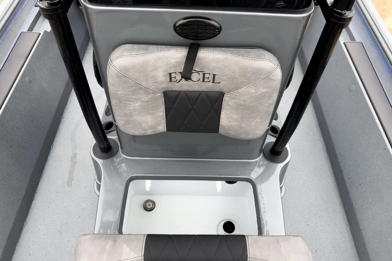 Slide: The Image of Interior of 2026 Excel Bay Pro Elite 230 boat, featuring stylish seating and storage. - 31