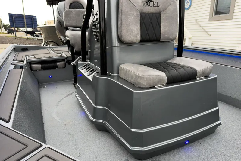 Slide: The Image of 2026 Excel Bay Pro Elite 230 boat interior with cushioned seating and sleek design. - 32