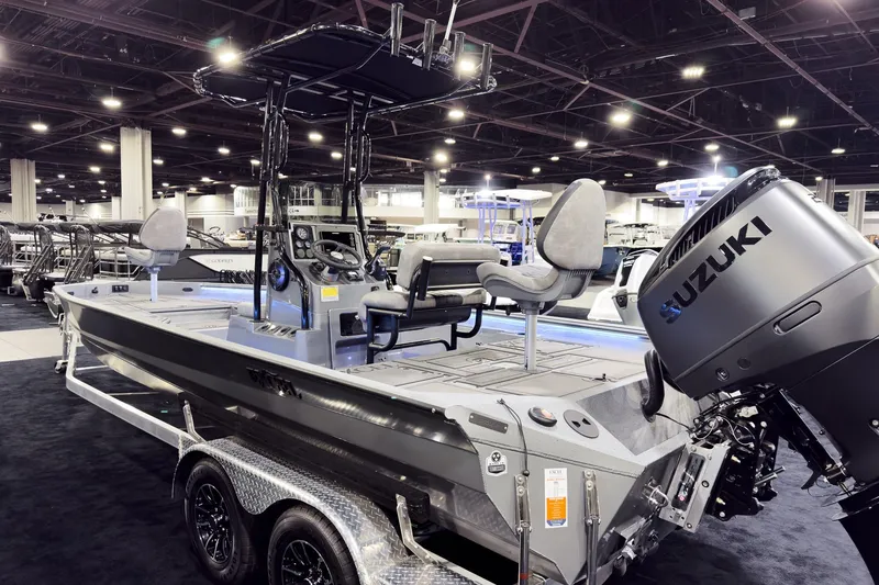 Slide: The Image of 2026 Excel 230 Bay Pro Elite boat with Suzuki engine at indoor exhibition. - 4