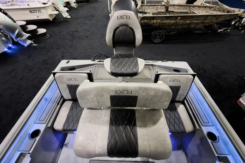 Slide: The Image of 2026 Excel 230 Bay Pro Elite boat interior with cushioned seating and modern design. - 8