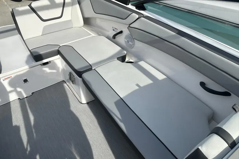 Slide: The Image of 2024 Yamaha Boats AR220 interior seating with sleek, modern design and comfortable upholstery. - 12