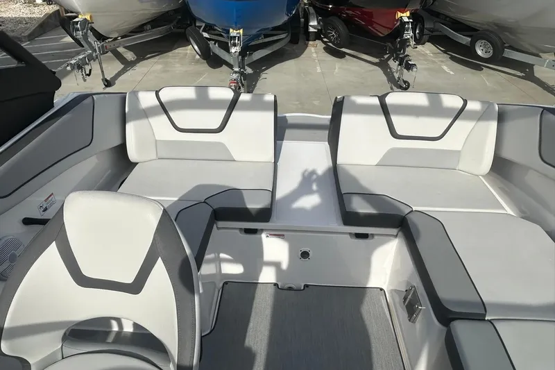 Slide: The Image of 2024 Yamaha Boats AR220 interior seating with modern design and comfortable upholstery. - 13