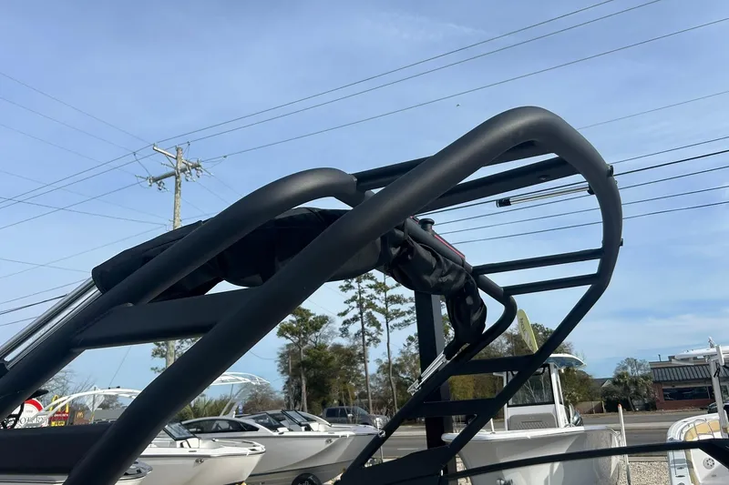 Slide: The Image of 2024 Yamaha Boats AR220 wakeboard tower against a clear blue sky. - 8