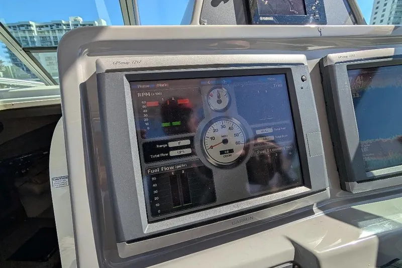 Slide: The Image of Dashboard of a 2014 Robalo R305 Walkaround boat with Garmin GPS and Yamaha display. - 23