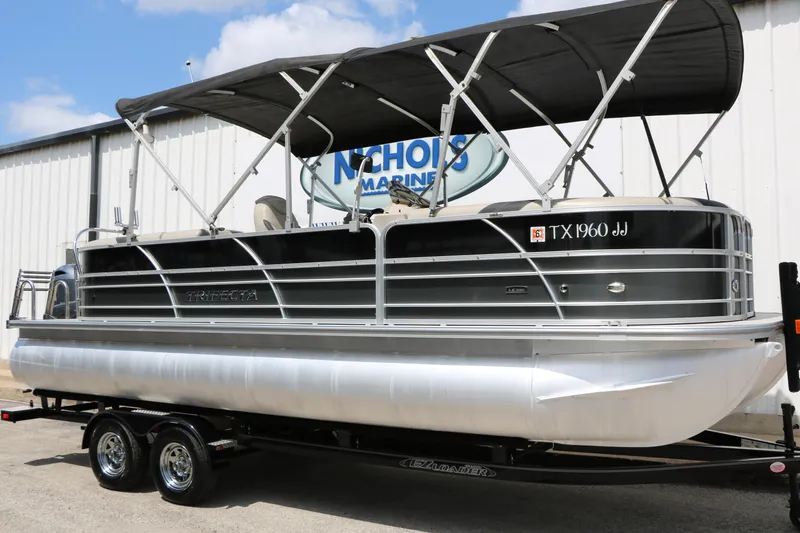 The Image of 2020 Trifecta 24RF LE pontoon boat with canopy on trailer at Nichols Marine. - 1