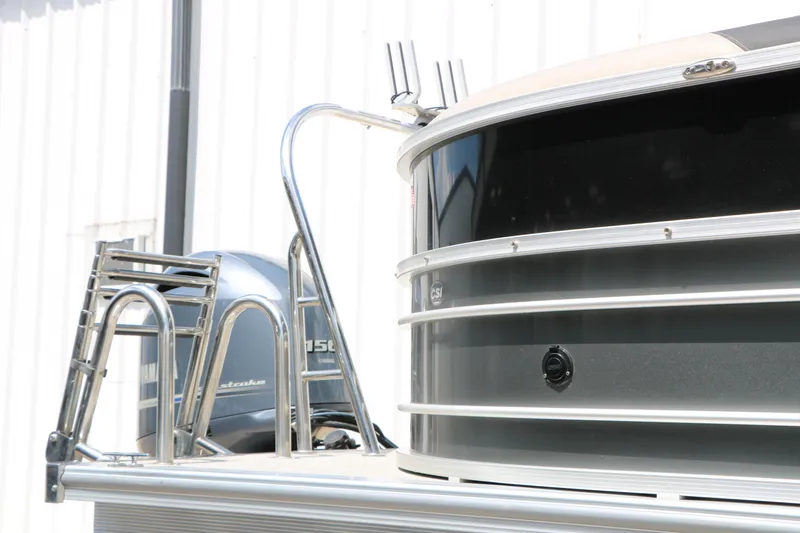 Slide: The Image of 2020 Trifecta 24RF LE pontoon boat with stainless steel ladder and outboard motor. - 17