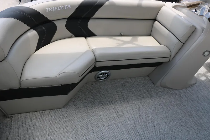 Slide: The Image of 2020 Trifecta 24RF LE boat interior with beige seating and speaker detail. - 21
