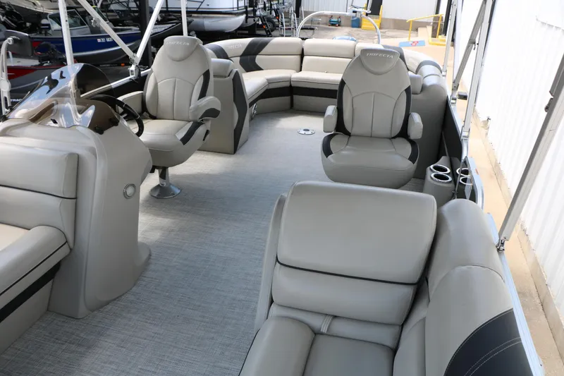 Slide: The Image of 2020 Trifecta 24RF LE pontoon boat interior with plush seating and modern helm. - 23