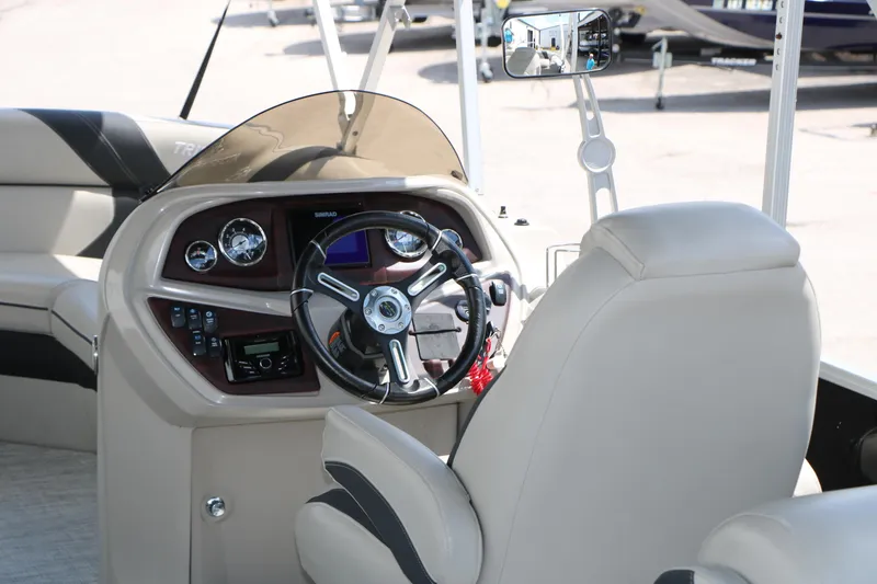 Slide: The Image of Interior view of 2020 Trifecta 24RF LE boat's steering console and seating. - 27