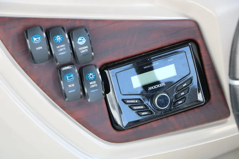 Slide: The Image of Control panel of 2020 Trifecta 24RF LE with switches and Kicker media center. - 38