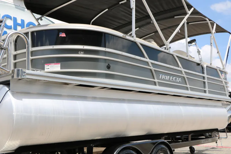 Slide: The Image of 2020 Trifecta 24RF LE pontoon boat with sleek design and canopy. - 8