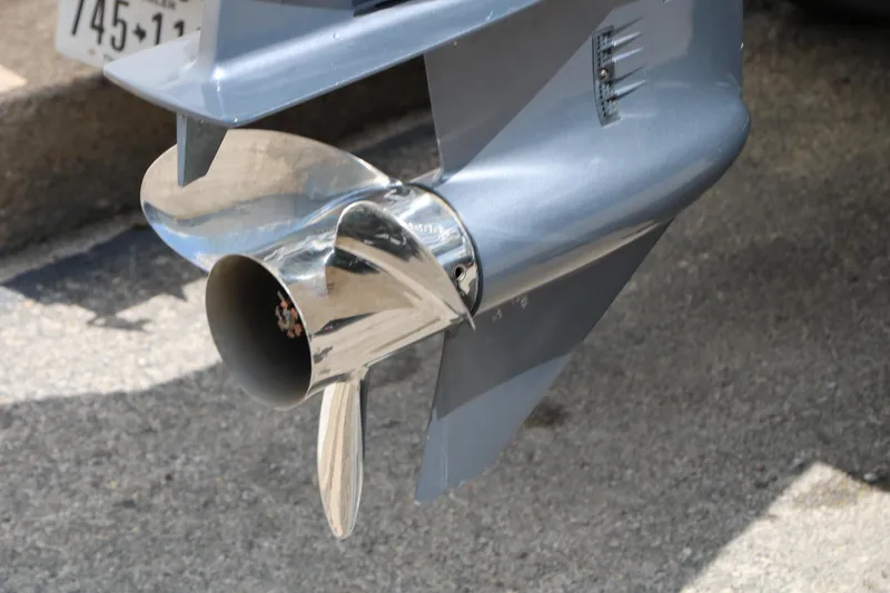 Slide: The Image of Close-up of a 2020 Trifecta 24RF LE boat propeller on pavement. - 9