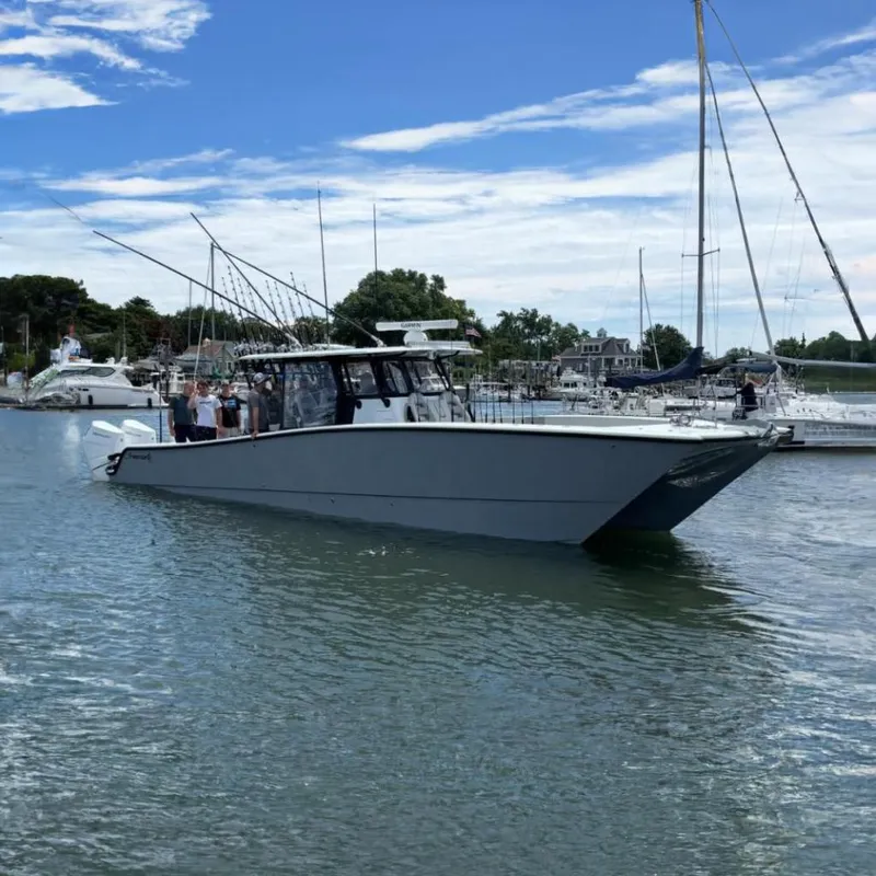 The Image of Freeman 42LR 2024 boat in harbor with fishing rods. - 0
