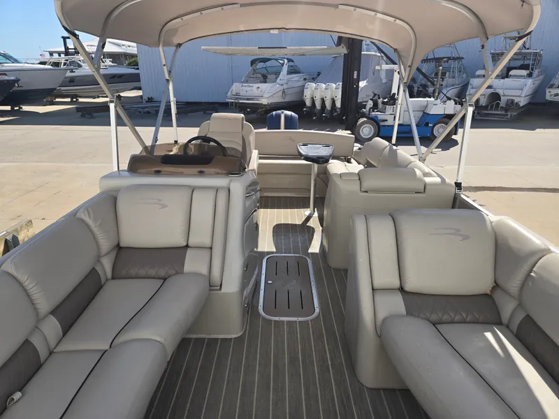 Slide: The Image of Interior of a 2017 Bennington R23 pontoon boat at the dock. - 9