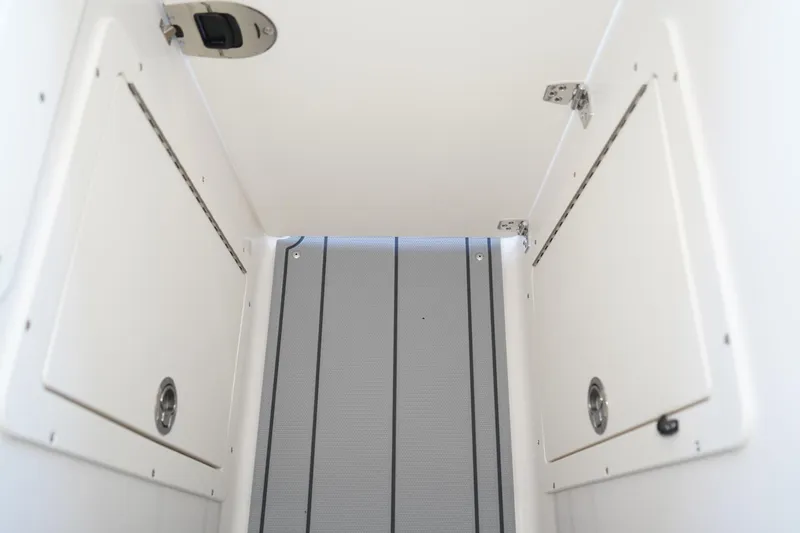 Slide: The Image of Interior storage compartment of 2026 Chaparral 21 SSi OB boat. - 11