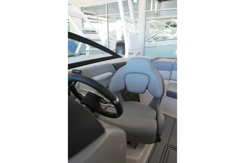 Slide: The Image of 2026 Chaparral 21 SSi OB boat interior with steering wheel and seating. - 15