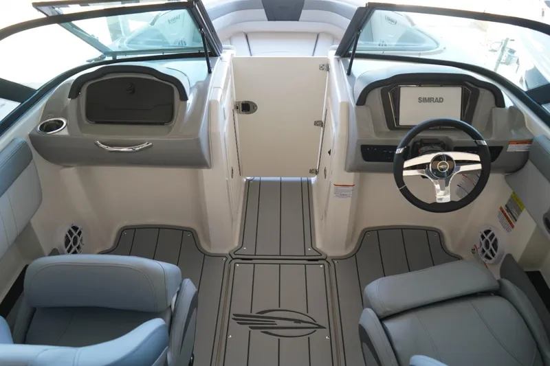 Slide: The Image of Interior of 2026 Chaparral 21 SSi OB boat with modern dashboard and seating. - 4