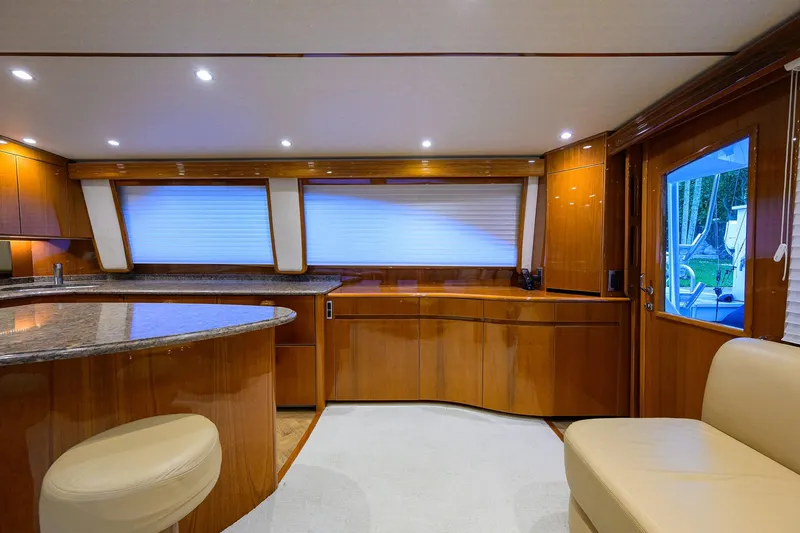 Slide: The Image of Luxurious interior of 2015 Viking 62 Convertible yacht with elegant wood finishes and modern lighting. - 12