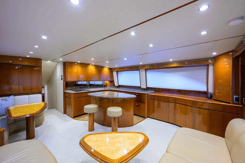 Slide: The Image of Luxurious interior of 2015 Viking 62 Convertible yacht with elegant wood finishes and modern lighting. - 15