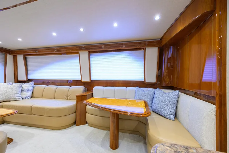 Slide: The Image of Luxurious interior of 2015 Viking 62 Convertible yacht with plush seating and elegant wood finishes. - 18
