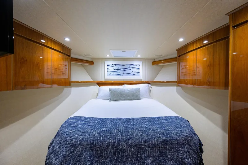 Slide: The Image of Luxurious cabin interior of 2015 Viking 62 Convertible yacht with cozy bed and elegant wood finish. - 20