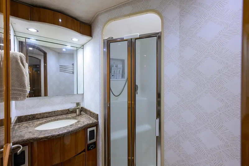 Slide: The Image of Luxurious bathroom in 2015 Viking 62 Convertible yacht with modern fixtures and elegant design. - 37