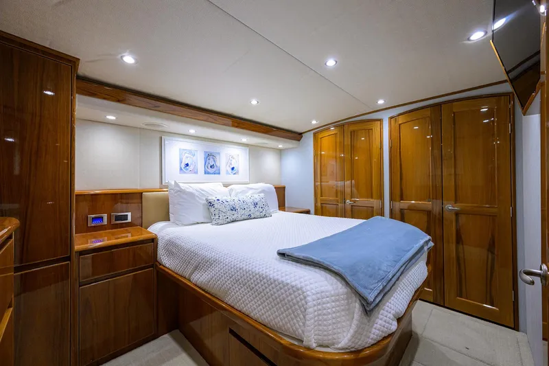 Slide: The Image of Luxurious cabin interior of 2015 Viking 62 Convertible yacht with elegant wood finishes. - 41