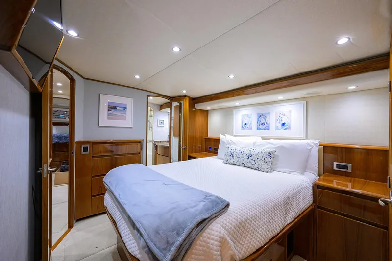 Slide: The Image of Luxurious bedroom interior of 2015 Viking 62 Convertible yacht with elegant wood finishes. - 43