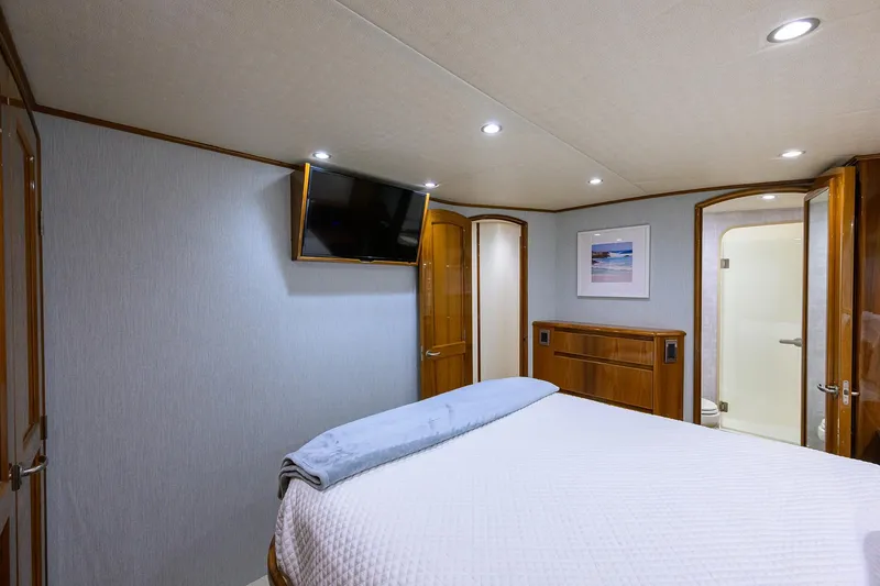 Slide: The Image of Luxurious bedroom interior of 2015 Viking 62 Convertible yacht with modern amenities. - 44