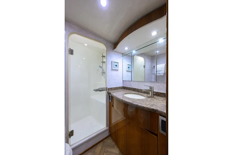 Slide: The Image of Luxurious bathroom in 2015 Viking 62 Convertible yacht with modern fixtures and elegant design. - 47
