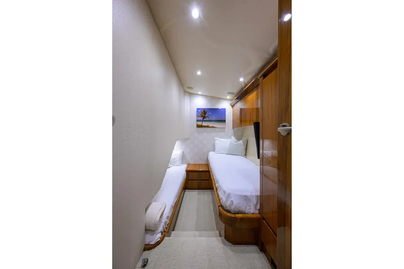 Slide: The Image of Interior of 2015 Viking 62 Convertible yacht with twin beds and modern decor. - 52