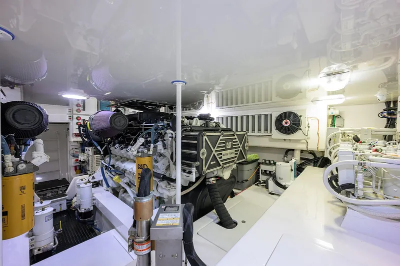 Slide: The Image of Engine room of 2015 Viking 62 Convertible yacht, featuring CAT marine engines. - 65