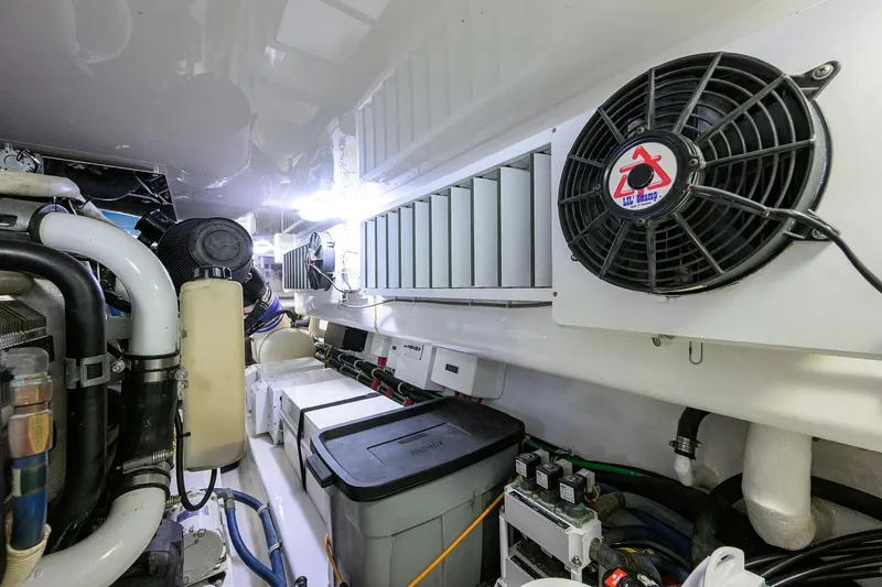 Slide: The Image of Engine room of 2015 Viking 62 Convertible yacht, featuring ventilation and mechanical components. - 66