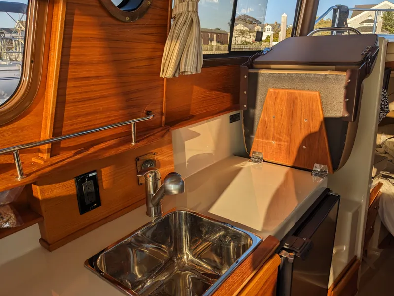 Slide: The Image of Interior of Ranger Tugs R-27 yacht kitchen, 2021 model. - 22
