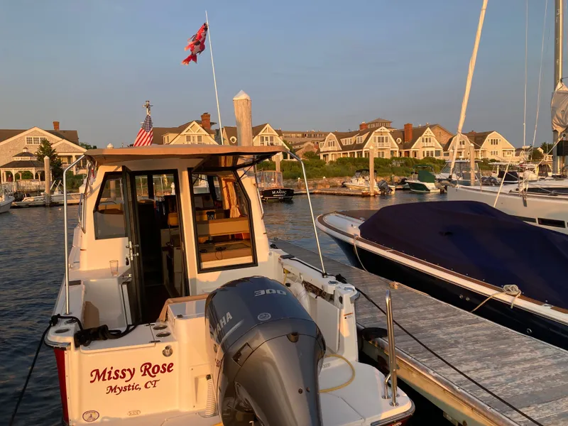 Slide: The Image of Ranger Tugs R-27 boat docked at marina, 2021 model. - 6