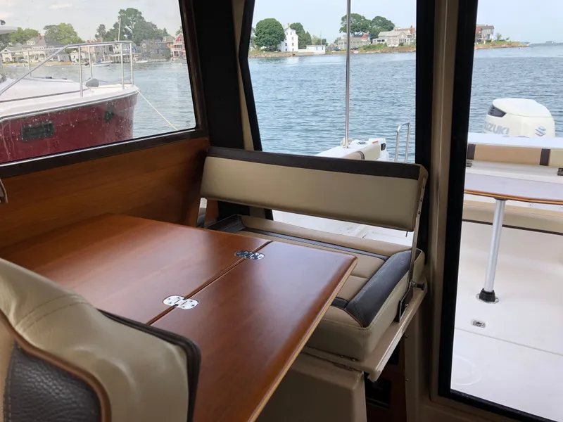 Slide: The Image of Interior of Ranger Tugs R-27 yacht, view of water and harbor. - 8
