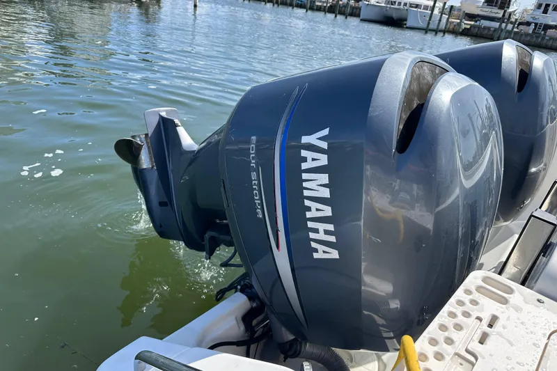 Slide: The Image of Twin Yamaha outboard engines on a 2007 Pursuit OS 285 Offshore boat. - 19