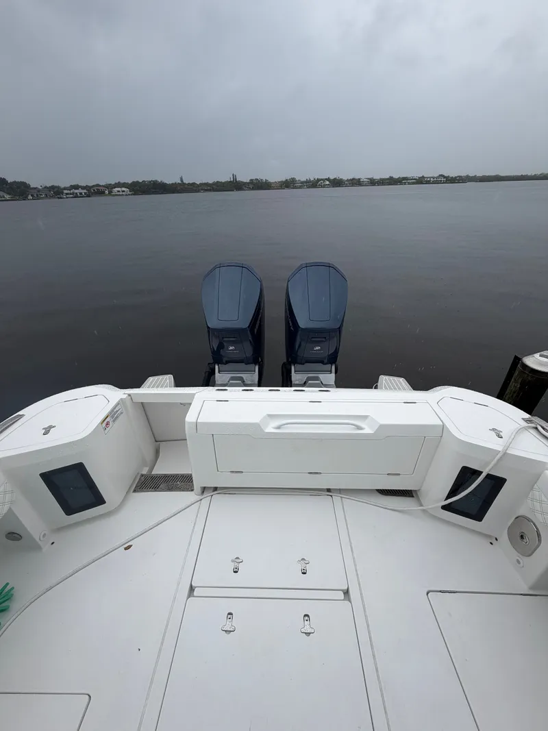 The Image of Rear view of a 2024 Intrepid Valor boat with twin outboard engines. - 0