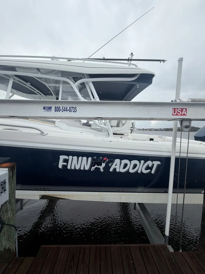 Slide: The Image of 2024 Intrepid Valor boat with "Finn Addict" lettering at dock. - 18