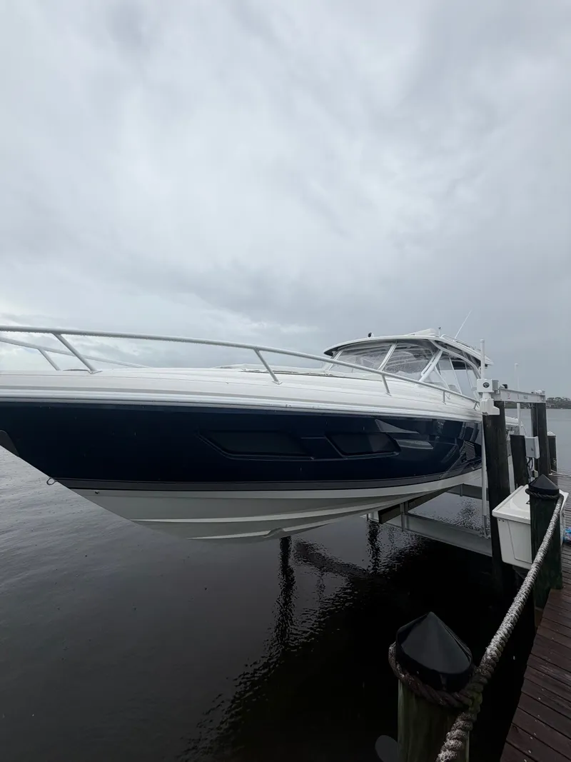 Slide: The Image of 2024 Intrepid Valor boat docked under cloudy skies. - 19