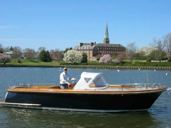 The Image of Beaver Yachts Dutch Express Launch 2000 on a serene river. - 1