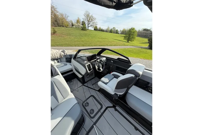 Slide: The Image of Interior of 2023 Malibu Wakesetter 23 LSV boat with modern seating and dashboard. - 14