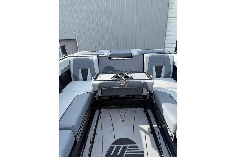 Slide: The Image of 2023 Malibu Wakesetter 23 LSV interior with gray seating and cup holders. - 6