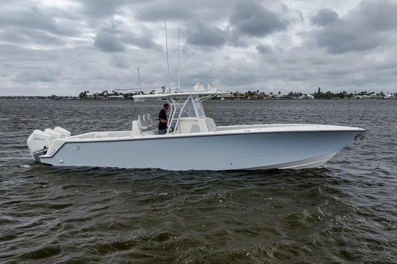 The Image of 2022 SeaVee 370Z boat on water under cloudy sky, side view. - 1