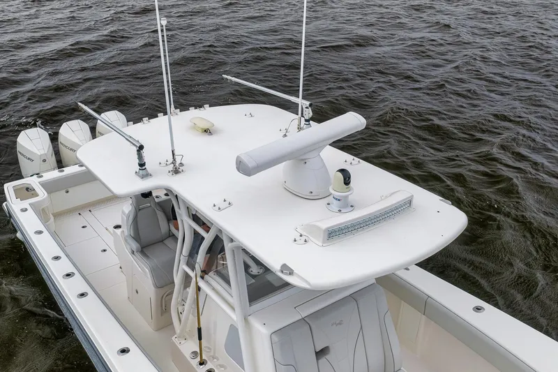 Slide: The Image of 2022 SeaVee 370Z boat with advanced radar and seating, cruising on open water. - 11