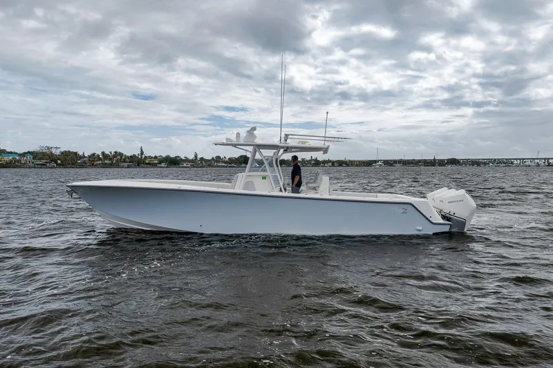 Slide: The Image of 2022 SeaVee 370Z boat on water under cloudy sky. - 14