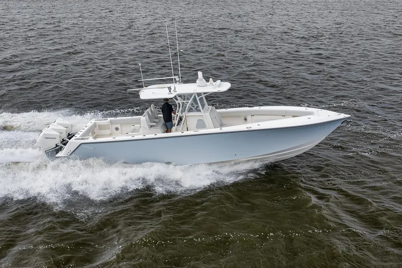 Slide: The Image of 2022 SeaVee 370Z boat cruising on open water, showcasing sleek design and powerful engines. - 17