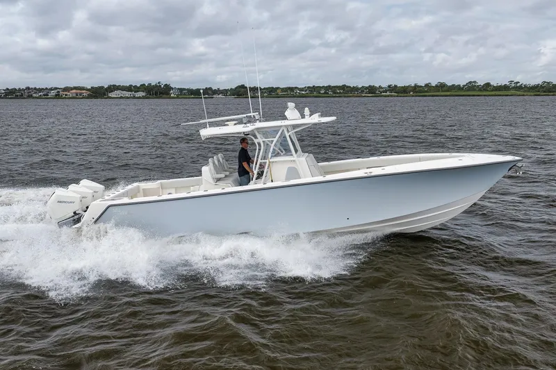 Slide: The Image of 2022 SeaVee 370Z boat cruising on water with outboard engines. - 18