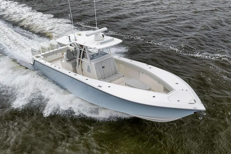 Slide: The Image of 2022 SeaVee 370Z boat cruising on open water, showcasing sleek design and powerful engines. - 19